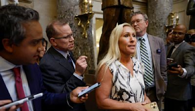 Rep. Marjorie Taylor Greene huddles with U.S. House speaker she’s trying to oust