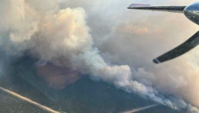 Wildfires across western U.S. and Canada force thousands to evacuate