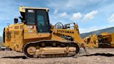 Cat 963 track loader equipped with 6-way dozer blade (Video)