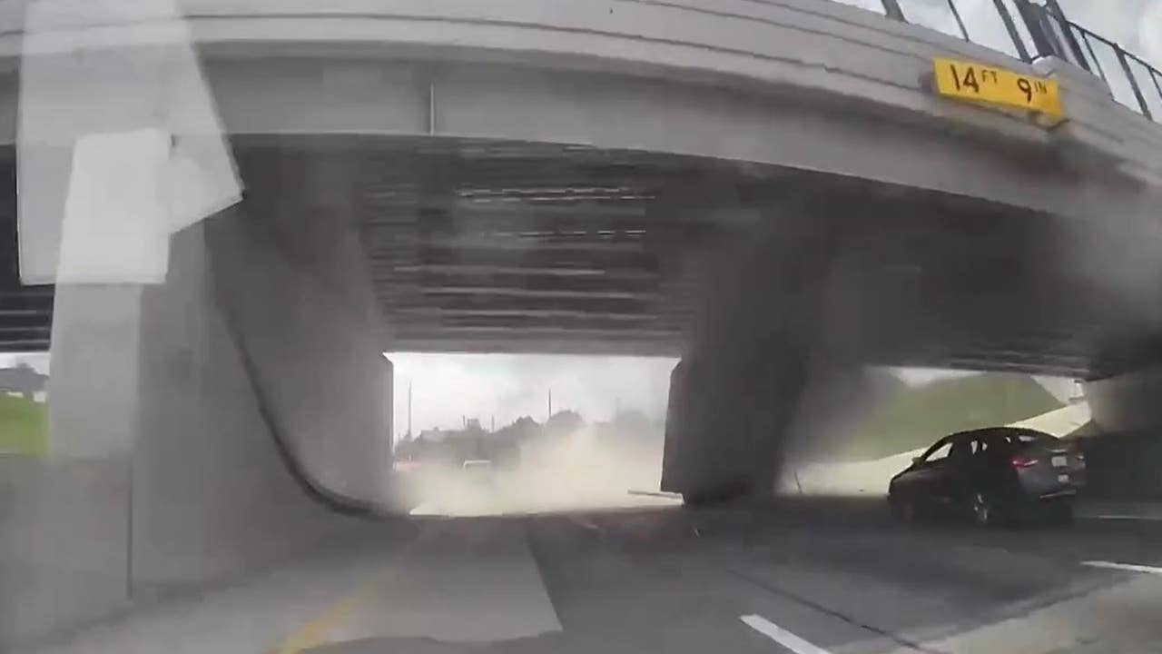 Video shows moment truck hauling gravel slams into overpass on I-94 in Detroit