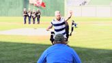Marine veteran throws first pitch at baseball game after double arm transplant