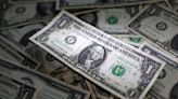 Dollar pauses as Fed officials weigh in; yen firm despite GDP surprise