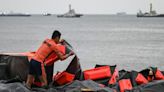 Philippines rushes to stop oil spill with barriers