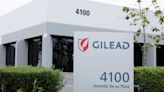 Gilead posts quarterly loss, revenue rises 5%