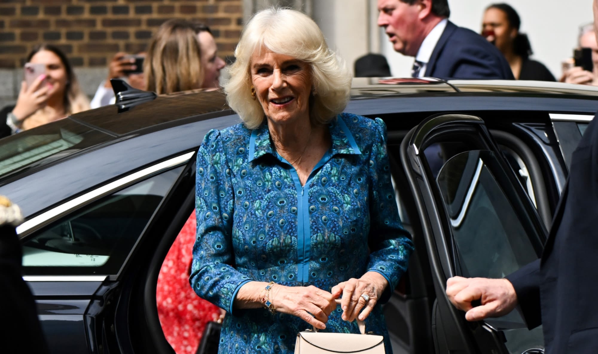 Queen Camilla Embraces Peacock Print for Primary School Visit in London