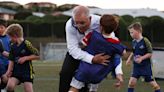 Australia's prime minister accidentally bowled over a kid while making a campaign stop with a local children's soccer team