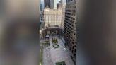 Moment glass falls out of windows from high-rise building near pedestrians below