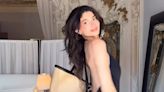 Kylie Jenner showcases her bare back in plunging black capri catsuit