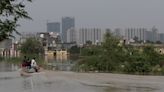 People living near Yamuna River in New Delhi return home as waters recede