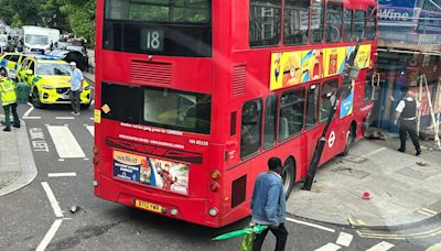 Six hurt as London bus crashes into scaffolding