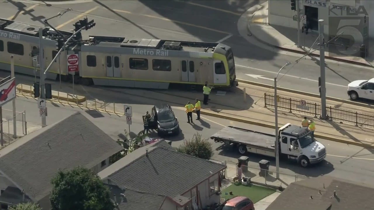 Metro train strikes vehicle, derails in East L.A.