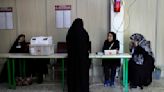 Iranians vote in a parliamentary runoff election after hard-liners dominate initial balloting