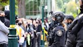 Police arrest 8 more after protesters rip down barricades, break into PSU library again