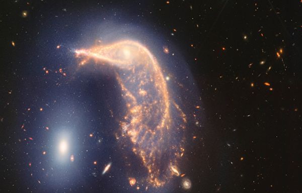 Webb Space Telescope’s latest cosmic shot shows pair of intertwined galaxies glowing in infrared