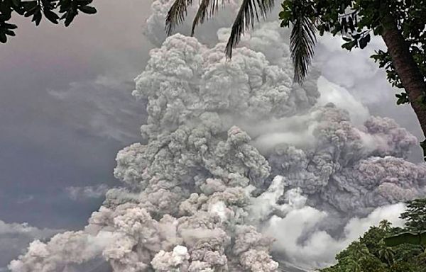 Indonesia's Mount Ruang erupts again, spewing ash and peppering villages with debris