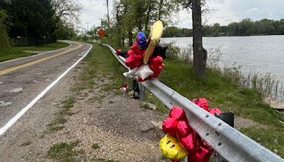 Balloons placed where young boy's body was pulled from the Flint River