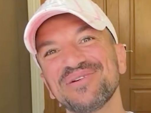 Peter Andre catches famous TV presenter sunbathing topless