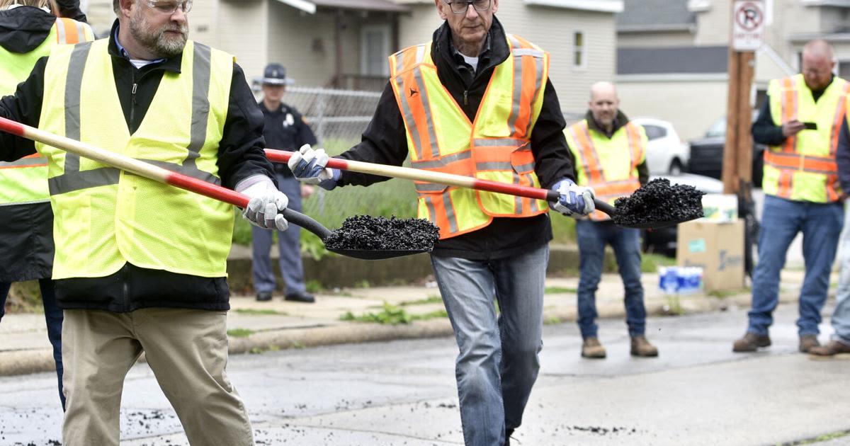 Governor Evers stops in Racine to fill potholes Tuesday morning