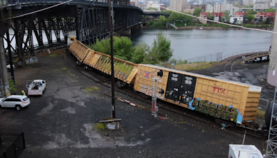 Drone footage reveals extent of Steel Bridge train derailment