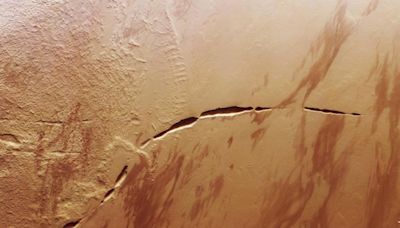 Mars Spacecraft Spots ‘Snaking Scar’ At The Foot Of A Massive Volcano