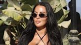 Yazmin Oukhellou turns heads in a skimpy black bikini in Marbella