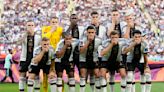 Germany players cover mouths at World Cup in FIFA protest