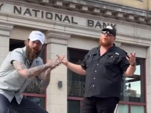 WATCH: Luke Combs + Post Malone Perform on a Moving Truck in Downtown Nashville