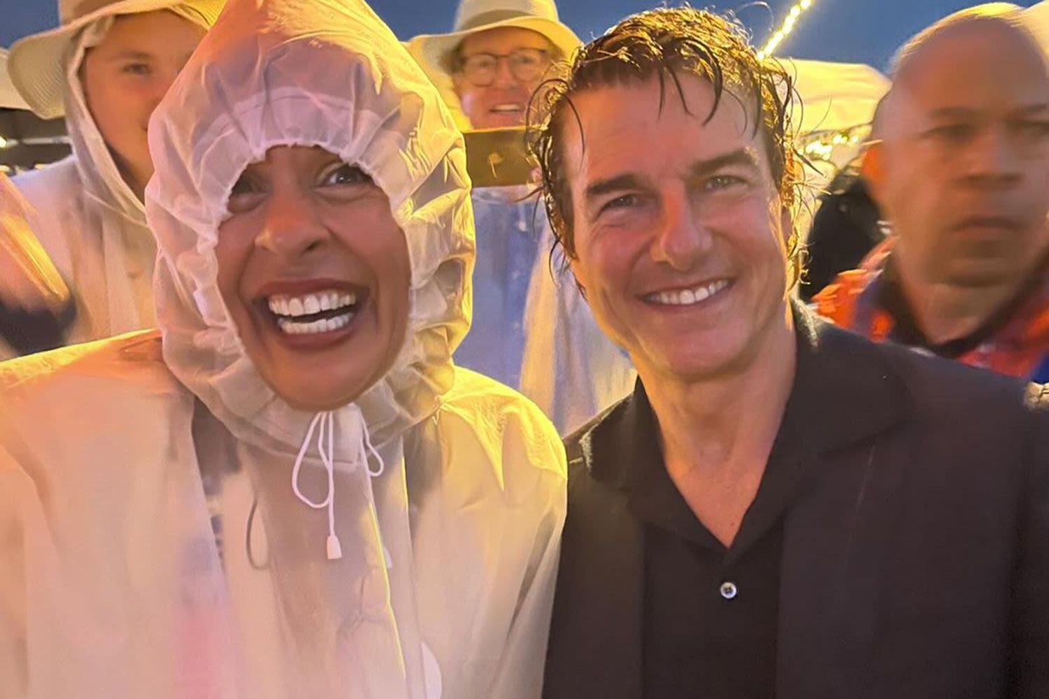 Hoda Kotb Rocks a Wet Poncho — and a Huge Grin — While Meeting Tom Cruise for the First Time at the Olympics