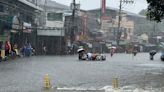 Taiwan prepares for a strong typhoon that worsened monsoon rains in the Philippines, killing 13