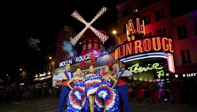 The Moulin Rouge cabaret in Paris has its windmill back, weeks after a stunning collapse