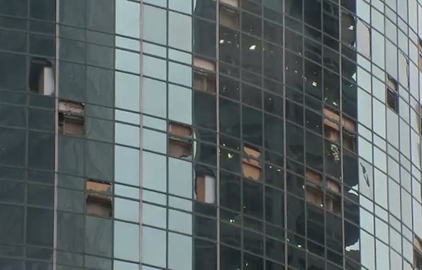 Downtown Houston riddled with glass after storm tore windows out of high-rise buildings