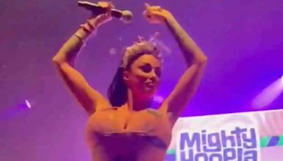 Katie Price performs in a skin tight jumpsuit at Mighty Hoopla festival
