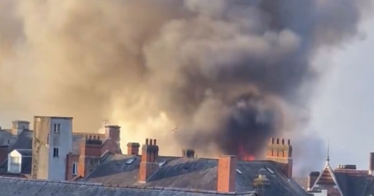 Massive fire sees town centre completely shut off as smoke cloud seen for miles