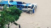 19 bodies recovered after landslide swept two buses into river in Nepal