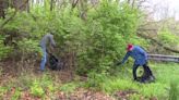 Community members clean up trash at 35th Street wetlands