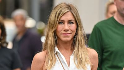 Jennifer Aniston kisses pup in ab-baring work-out photo inside home gym