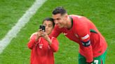 ‘Not the right way’: Selfie-hunting Ronaldo fans invade pitch at Euro match