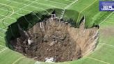 Huge sinkhole opens up under football pitch in Illinois