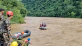 Search for dozens missing after landslide sweeps buses into Nepal river is suspended