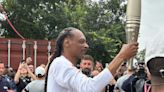 Crowds cheer as Snoop Dogg carries Olympic torch for Paris 2024 Games