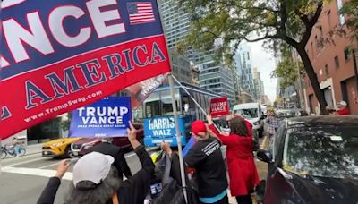 Trump Supporters 'Greet' Tim Walz's Bus In NYC With Trump-Vance Flags | WATCH