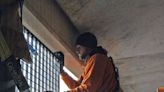 Installation of suicide prevention window barriers starts at Fifth and Walnut garage