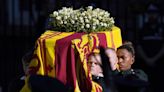 Queen funeral latest: Coffin arrives at Buckingham Palace as mourners line streets