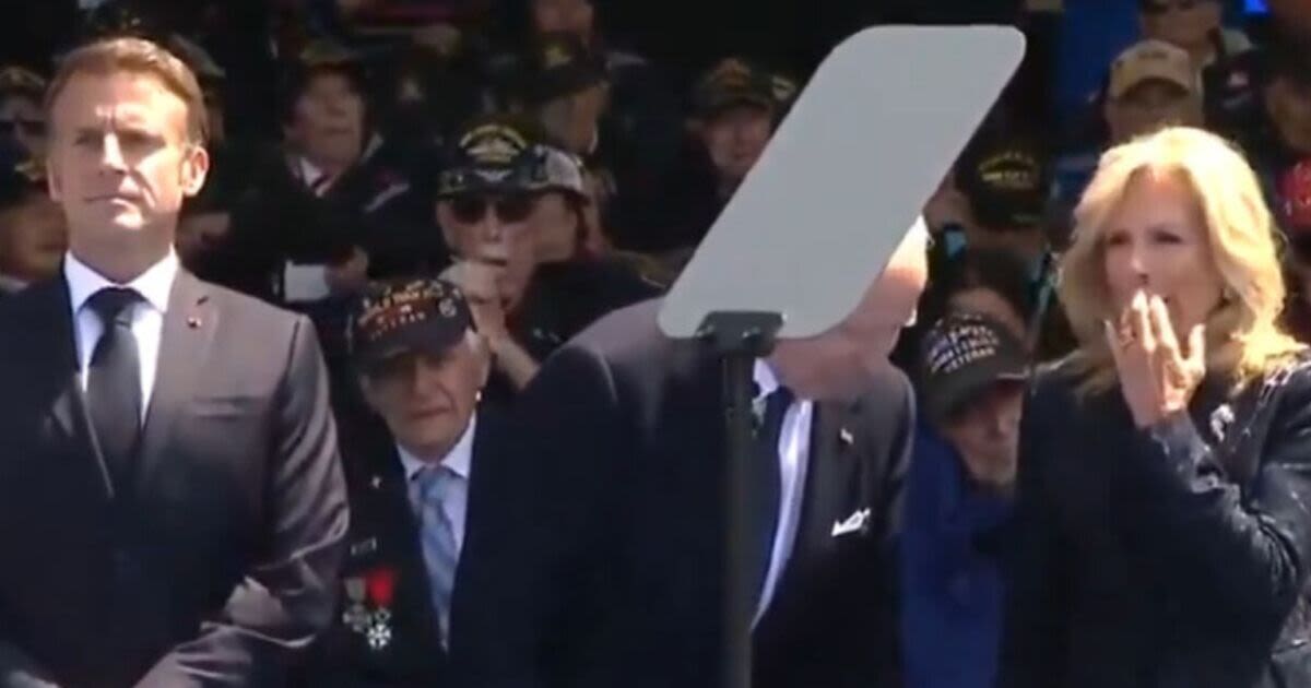 Joe Biden tries to sit on 'invisible chair' during D-Day memorial event