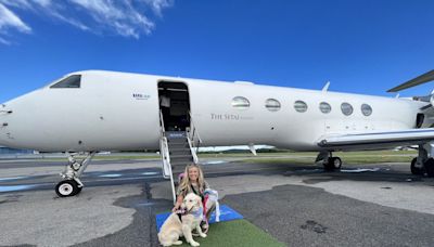 I flew 3,400 miles with my golden retriever on a one-of-a-kind luxury airline for dogs—here’s what it was like