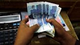 Pakistani rupee touches record low, bonds fall as IMF talks drag