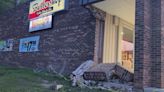 Vehicle crashes into strip mall in Rochester