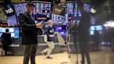 Stocks near flat, dollar dips as focus shifts to US inflation data