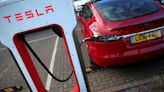 Analysis-Tesla's EV charging team layoffs threaten to slow Biden's program to electrify highways