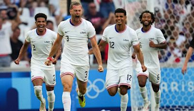 US stays alive with 4-1 win over New Zealand in Olympic men's soccer. Ukraine beats Morocco